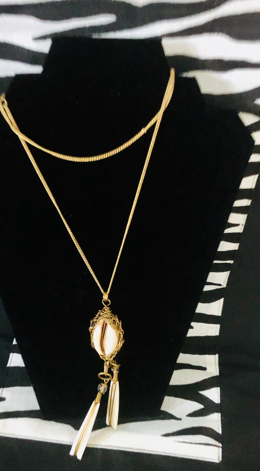 Brass chain & cowrie shell